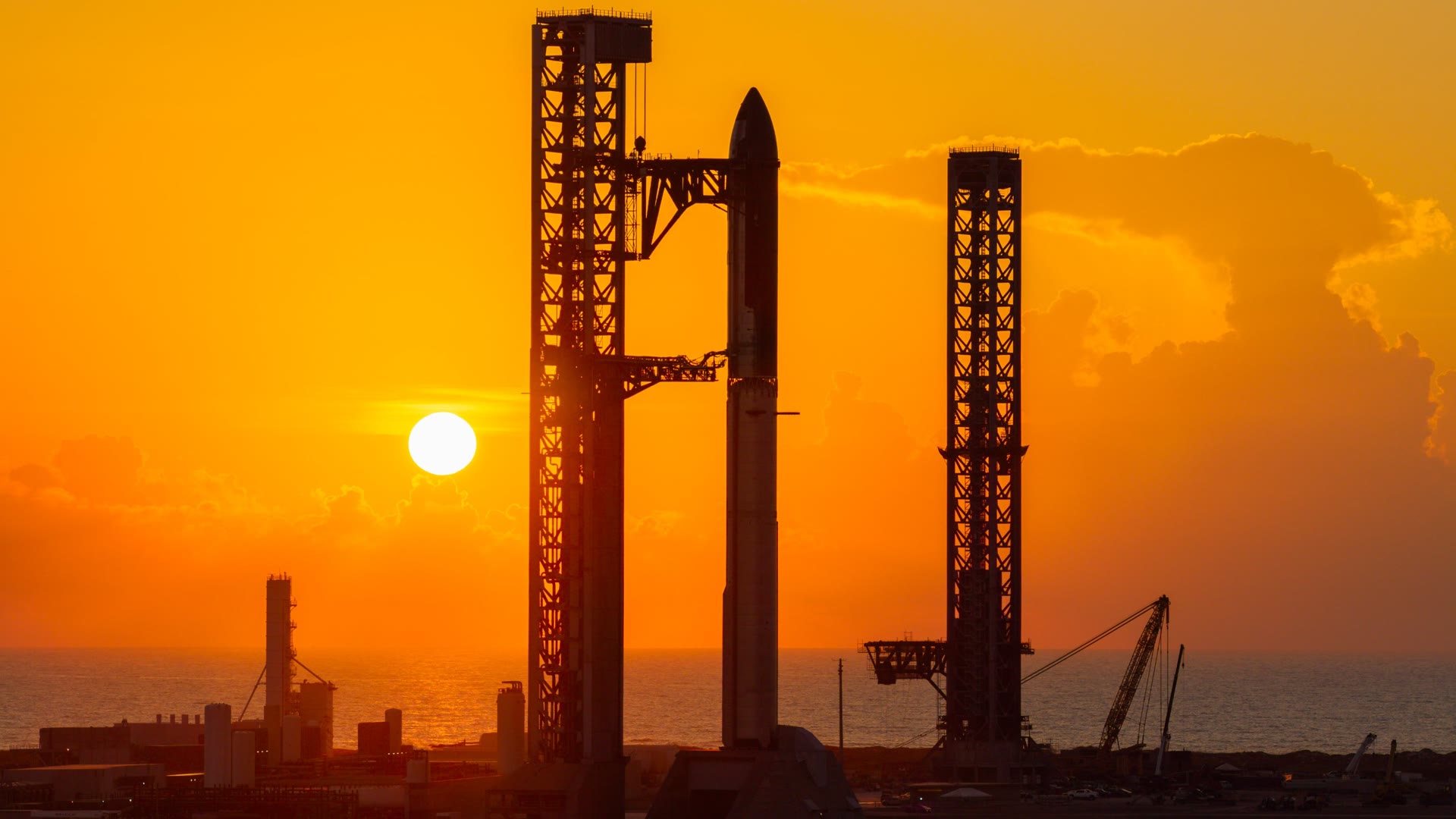 Starship on the pad at Starbase at sunset before Flight 14